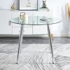 A glass tabletop with a diameter of 40 inches and a modern minimalist circular dining table with electroplated silver metal legs. Suitable for restaur